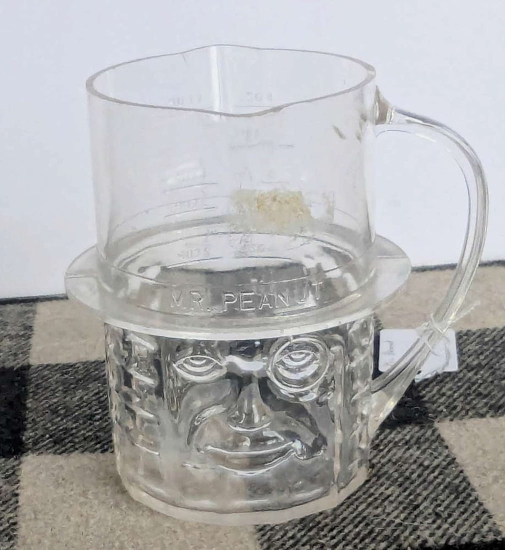vintage Mr. Peanut measuring cup: vintage ca. 1950's Planter's Mr. Peanut clear plastic measuring cup with pour spout, marked Made in USA on bottom as shown