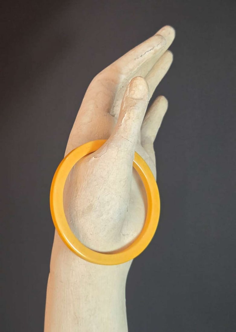 vintage estate jewelry: Bakelite bracelet: vintage or antique skinny egg yolk yellow flattened bangle bracelet, Art Deco period
