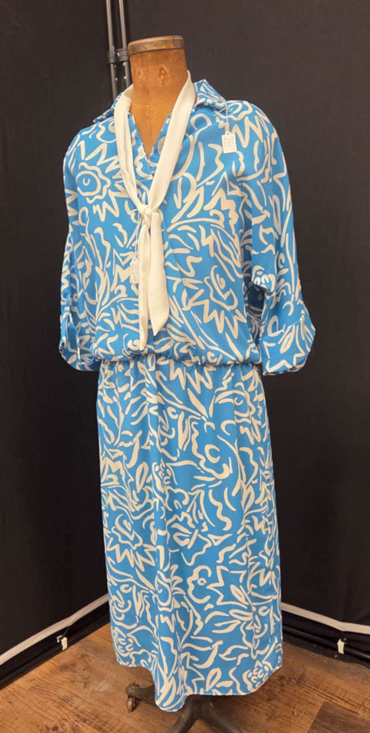 vintage ladies dress: vintage ca. 1950's or 60's cornflower blue and cream single piece waisted dress with neck sash or belt