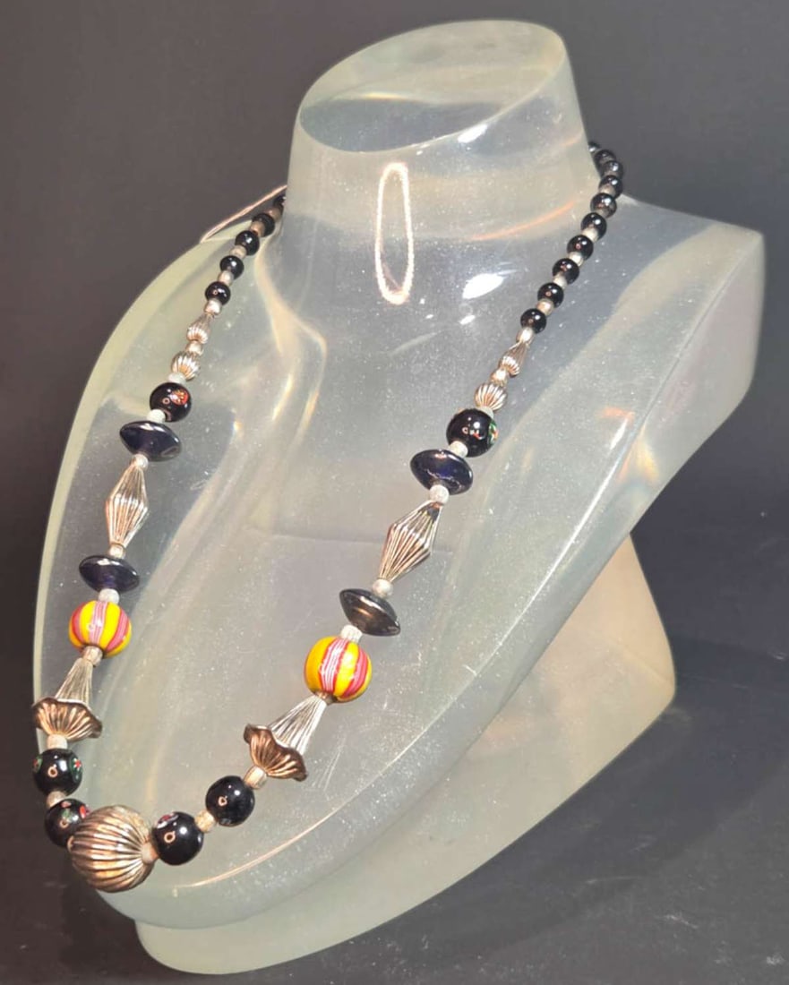 vintage estate jewelry: Murano glass necklace: vintage necklace with likely Murano glass, silver plated spacers, strung together with retro Art glass Lampwork and melon shaped beads about 23" long