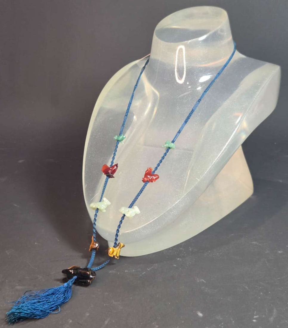 vintage estate jewelry: Native American necklace: vintage hand knotted blue string necklace with stone animal Indian Fetishes (two each) of a green Jade frog or toad, an orange Carnelian chicken or rooster, a light green Jade goat, 