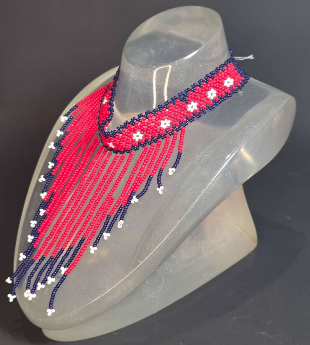 vintage estate jewelry: African necklace: vintage ethnic (likely African) choker style bin necklace made from white, blue and red trade beads and the neck piece with abstract floral design, knot closure as shown about 14 1/4"