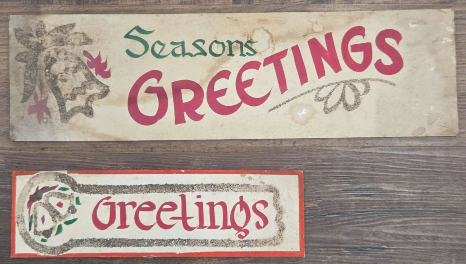 PAIR antique General store display Holiday signs: set or lot of two heavy cardstock hand painted and glitter signs with bells, great Christmas retail store pieces reading Seasons Greetings and Greetings larger is 22 1/4" long by 6