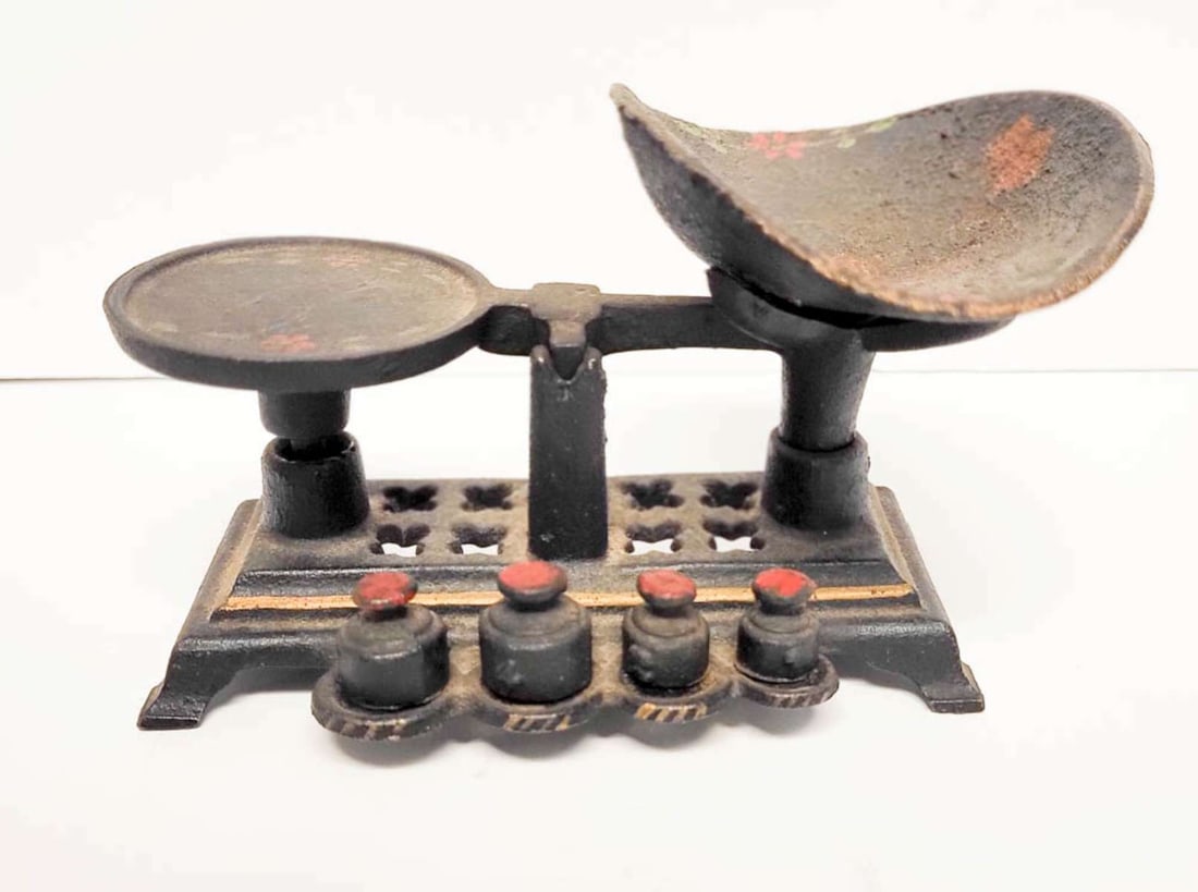 antique miniature measuring scale with weights: antique black cast iron miniature or pocket sized scale with four (4) weights, hand painted design about 5 3/4" long overall