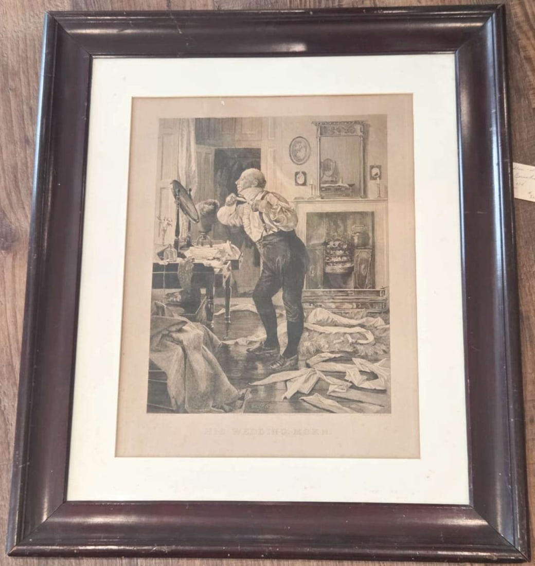 antique interior genre scene etching in frame: etching by W.H. Boucher after a painting by W. Dendy Sadler on embossed or watermarked paper as shown, framed and matted depicting of a gentleman shaving himself in a mirror, trying to get