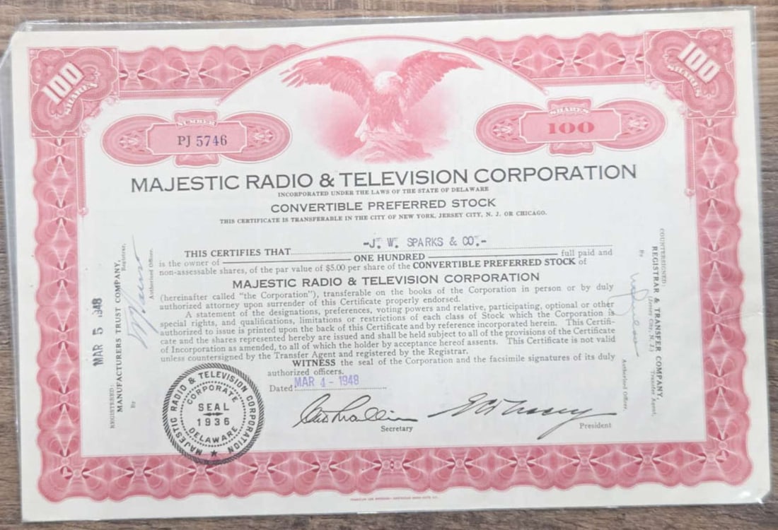1948 stock certificate radio and TV: vintage stock certificate for Majestic Radio and Television of Delaware with a beautiful red border and central engraving of a Bald Eagle about 12" high by 7 3/4" wide