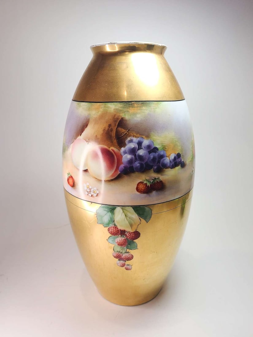 vintage German porcelain tall vase: antique ca. 1920's Heinrich and Co gilt and hand painted porcelain vase made in Selb, Bavaria and with fruit design of grapes, strawberries and peaches about 15 1/2" tall overall