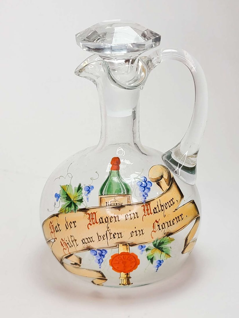 antique German glass liquor decanter: antique 1800's decanter, unmarked, but likely German or Austrian made glass pitcher with hand painted scroll and grapes design, married stopper about 8 1/4" tall with
