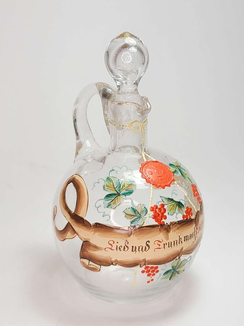 antique German glass liquor decanter: antique 1800's decanter, unmarked, but likely German or Austrian made glass pitcher with hand painted scroll and grapes design, original stopper about 7" tall overall with