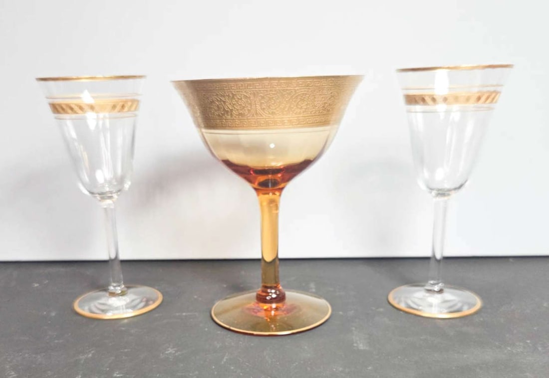 antique crystal and glass stemware: unmarked, but most likely Tiffin Franciscan single and matching pair of Fostoria Cascade stemware pieces with gilt rims and etched design tallest about 5" high by 3 7/8" in diameter
