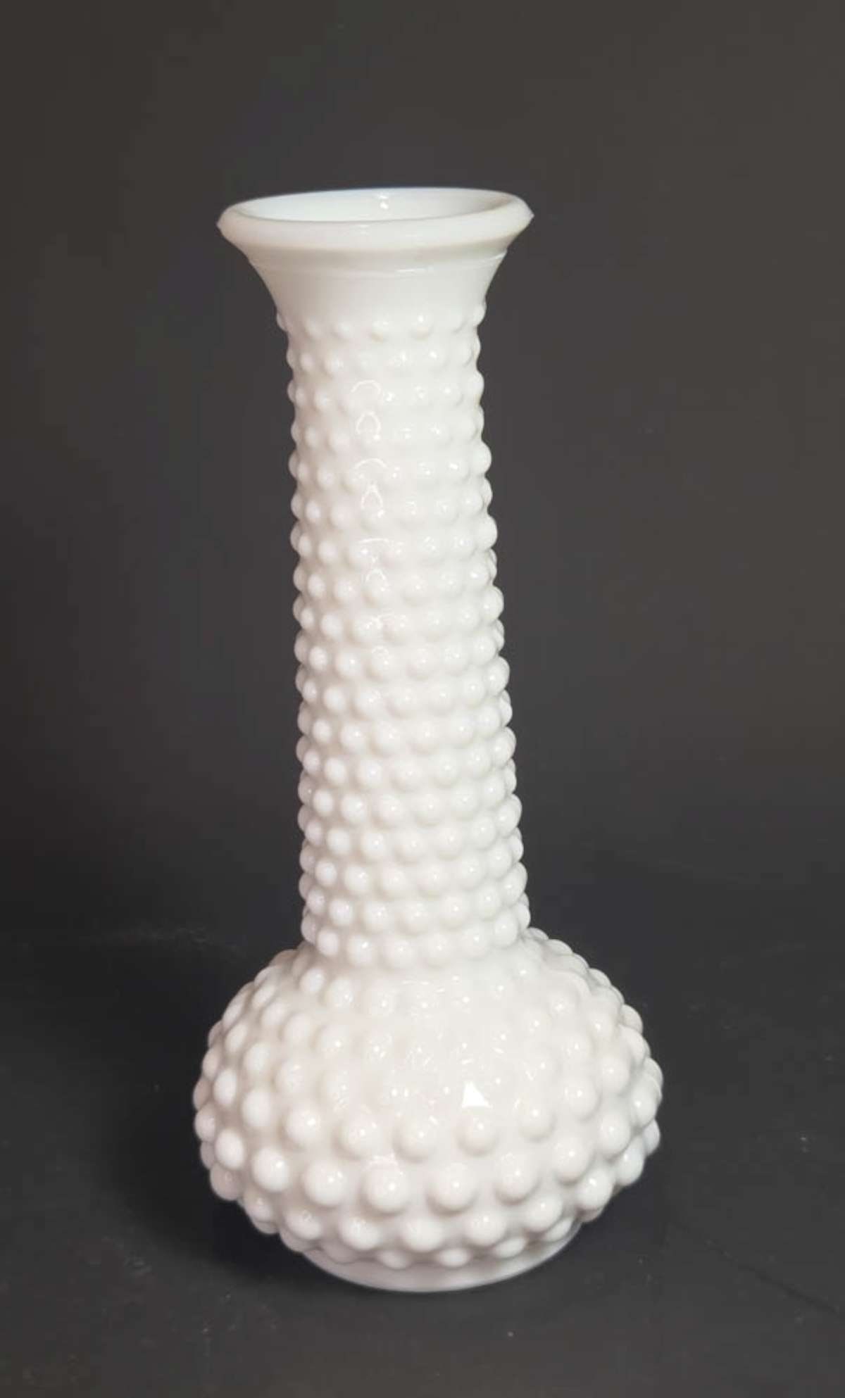 vintage milk glass Hobnail vase: vintage tall skinny top and bulbous bottom vase in white milk glass, underneath marked for E.O. Brody Co total height about 7 3/4" high