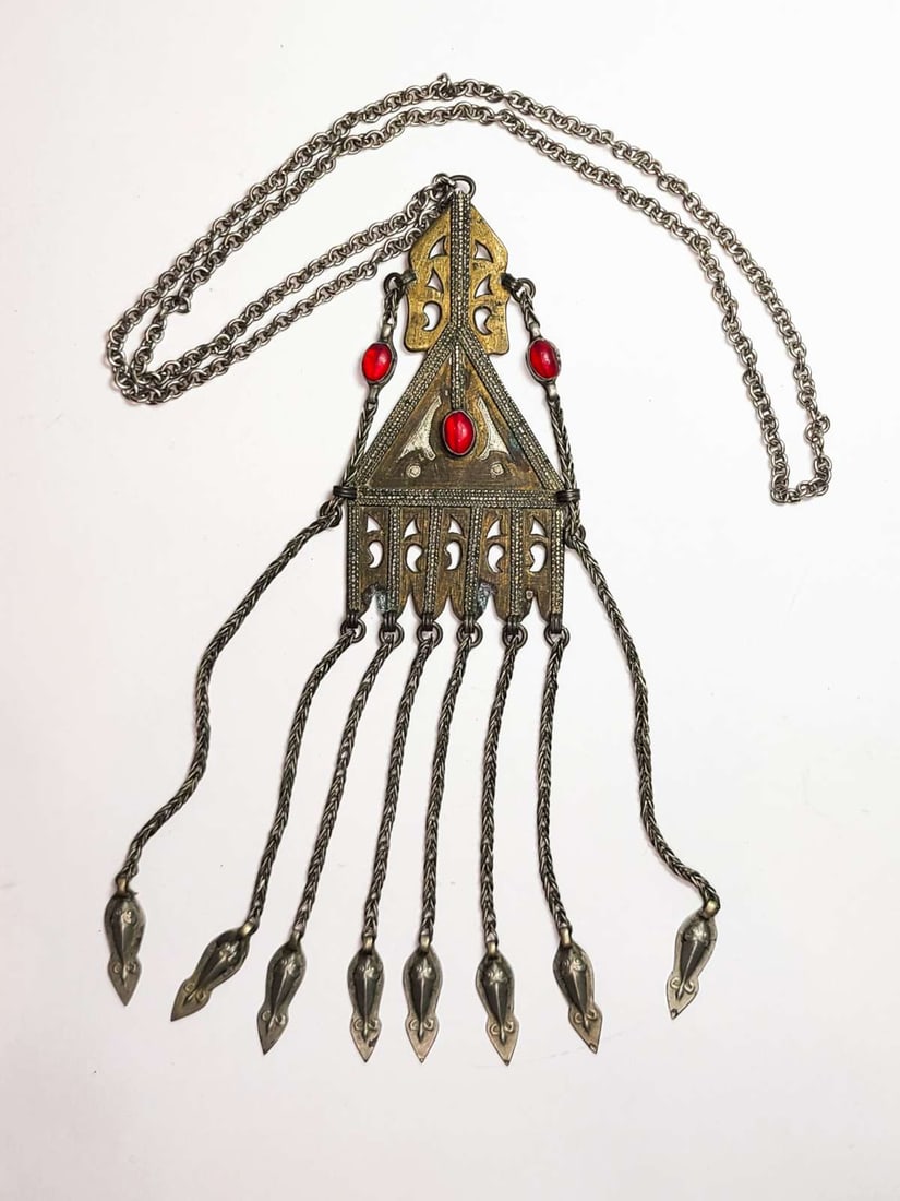 antique estate jewelry: Turkish silver necklace: antique Turkmen unmarked silver tribal pendant on vintage chair, pendant with inlaid cabochon beads of a red gemstone (Carnelian?), with dangly tassel fringe whole pendant about 9" lo