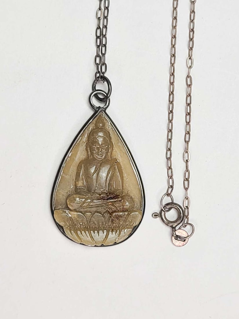 antique estate jewelry: religious Asian necklace: marked 925 for Sterling silver necklace with beautiful teardrop shaped pendant with inset carved green Jade Thai Deity or Buddha (please correct me if that's incorrect) in Lotus position necklace