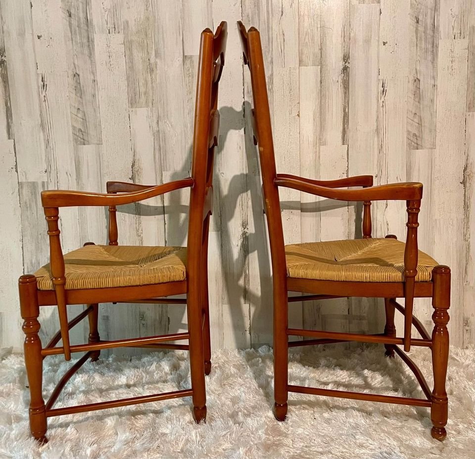 French Cordon Rush Seat Ladder Back Armchairs: French Provincial style armchairs. The cordon rush seat has a beautiful patina and is in excellent condition, adding warmth to any room. The shape of the ladder back and arms of this chair is characte