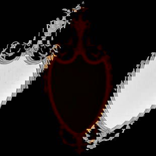 Friedman Brothers Rococo Style Carved Giltwood Gesso Wall Mirror: Brand: Friedman Brothers Decorative Arts New York Materials: Carved Giltwood and Gesso with Inset Glass Color: Gilt Item Type: Rococo Style Wall Mirror Design Features: The