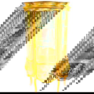 Remarkable Circa 1920s Gilt and Ormulu Vitrine Hand Painted French Motif: Era: Circa 1920s Materials: Gilt, Ormolu, Glass, Wood Color: Gold Item Type: Vitrine Design Features: This remarkable family heirloom vitrine, dating back to the 1920s, has been cherished by the