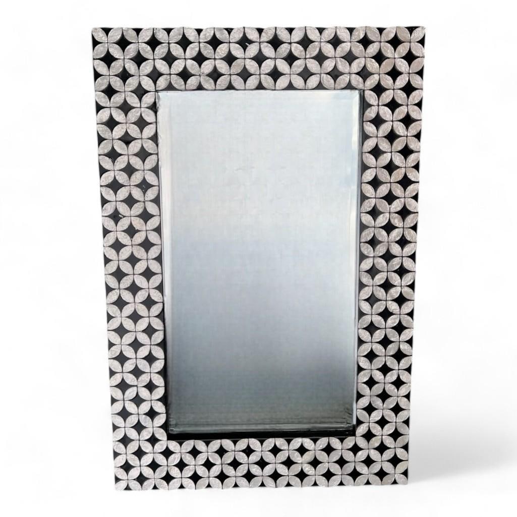 Black Wood Frame Mirror With Mother Of Pearl Inlay Rectangular Black And White: Design Features: The Black Wood Frame Mirror with Mother of Pearl Inlay is a sophisticated and elegant addition to any decor. The sleek black wood frame is enhanced by intricate mother of pearl inlay