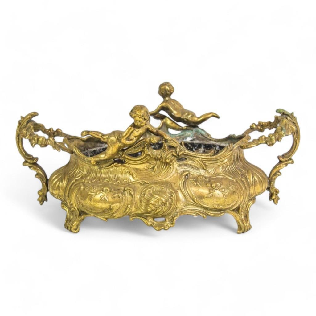 Antique French Gilt Gold Rococo Cherubs Jardiniere Planter Cache Pot Centerpiece: Exquisite antique French Rococo gilt gold jardiniere with cherub details. Perfect as a planter, cache pot, or centerpiece, adding timeless elegance to any décor. Dimensions: 13"L x 7"w x 6H