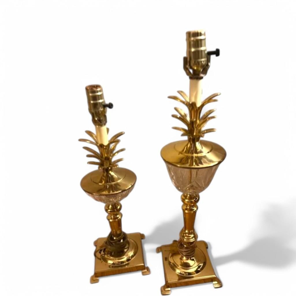 Vintage Bombay Pineapple Brass and Crystal Lamp, Pair: This pair of vintage table lamps from The Bombay Company features a pineapple motif crafted from brass and crystal. One lamp measures 19 inches in height, while the other stands at 23 inches. Please n