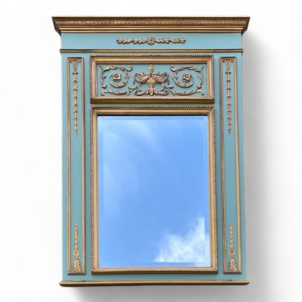 Carvers' Guild Marie Antoinette Trumeau Wall Mirror: ThisCarvers Guild custom wall mirror features a design inspired by 18th-century French trumeau aesthetics, reminiscent of the opulent halls of Versailles. The beveled mirror is framed by celadon green