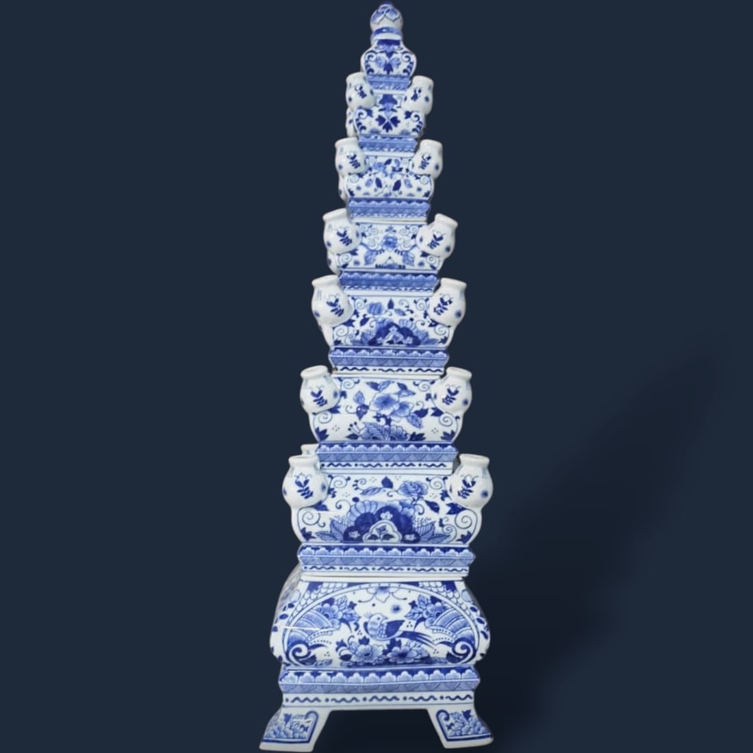 Tall Jingdezhen Blue and White Chinoiserie Porcelain Pagoda Tulipiere Vase Set: This set comprises of a four piece Jingdezhen porcelain tulipiere vase, each handcrafted in a pagoda-inspired design. The vases feature a harmonious blue and white color scheme, adorned with intricate