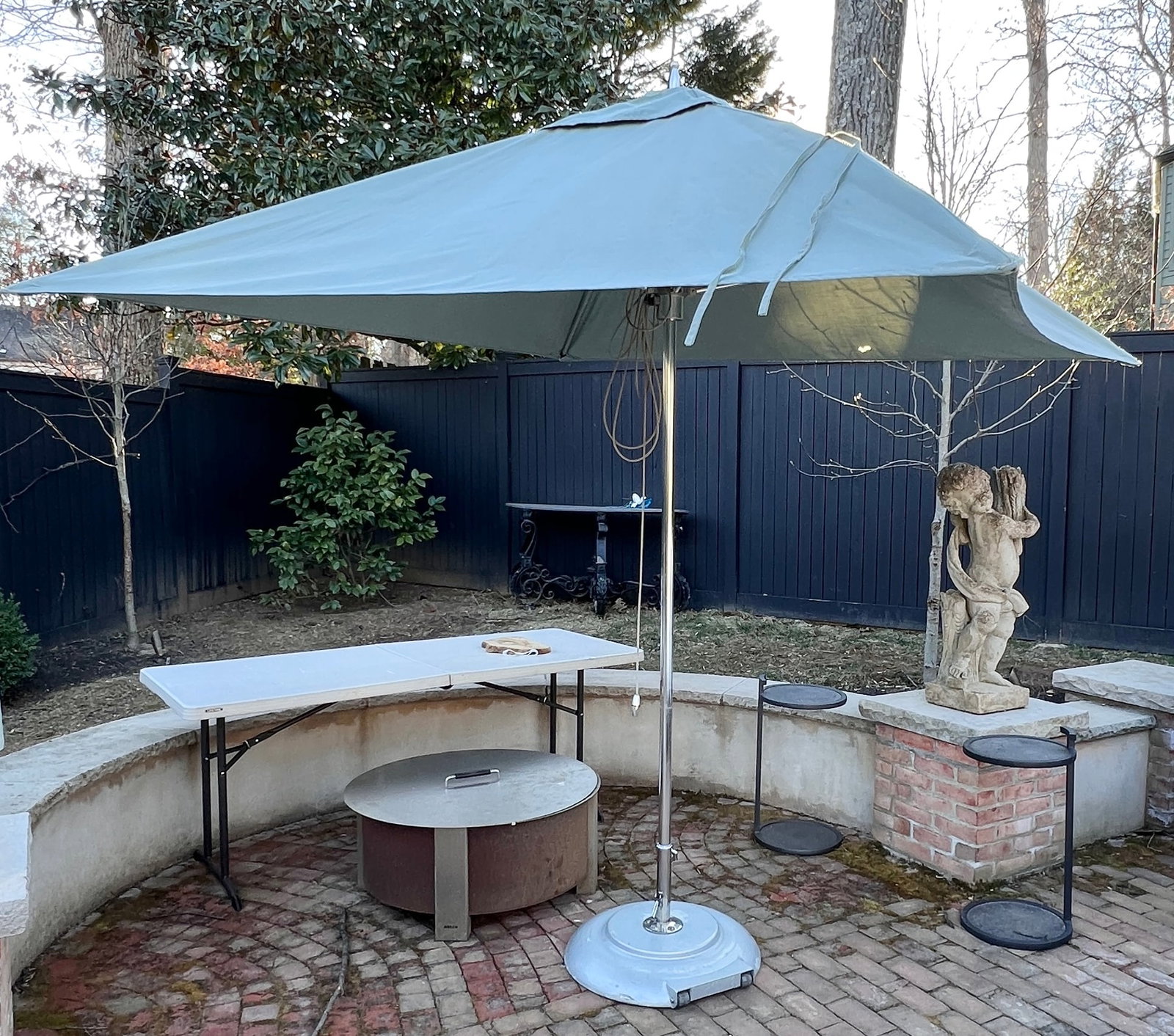 TUUCI Outdoor Luxury Umbrella with Wheeled TUUCI Base, $7,000 Retail (2 of 2): TUUCI center pole umbrella, renowned for durable and stylish outdoor shade solutions.Frame: Silver-toned metal rolling base for easy mobility.Canopy: Approximately 135 inches in diameter when open, pr