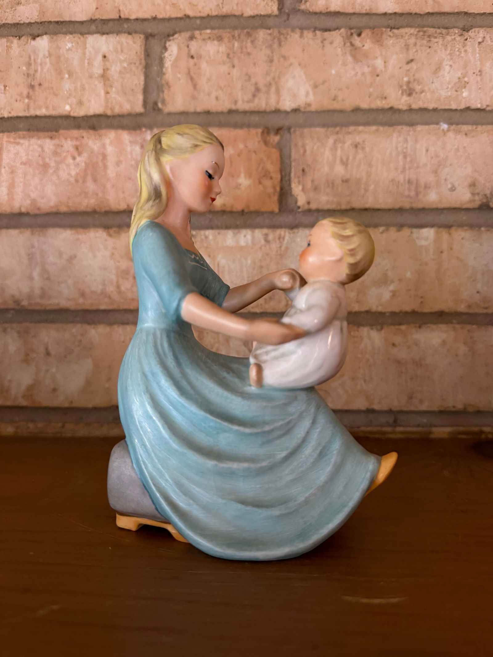 Vintage Goebel Hummel "Rock-a-bye Baby" porcelain figurine (BYJ-37): Vintage Goebel "Rock-a-bye Baby" porcelain figurine (BYJ-37), designed by artistCharlot Byj. Authentic Goebel Hummel porcelain figurine depicting a tender scene of a young mother holding a small child