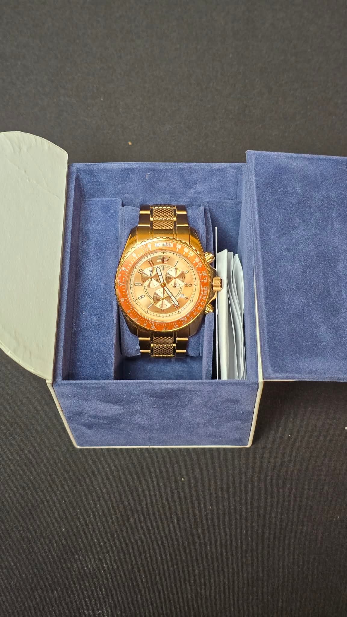 32 Degrees Rose Gold-Tone Chronograph Wristwatch w/ Tachymeter Bezel, Boxed AS-IS: 32° (Thirty-Two Degrees) Rose gold-tone chronograph-style wristwatch featuring a matching metal bracelet and a multi-function dial. The watch displays three sub-dials, luminous hands, applied hour ma