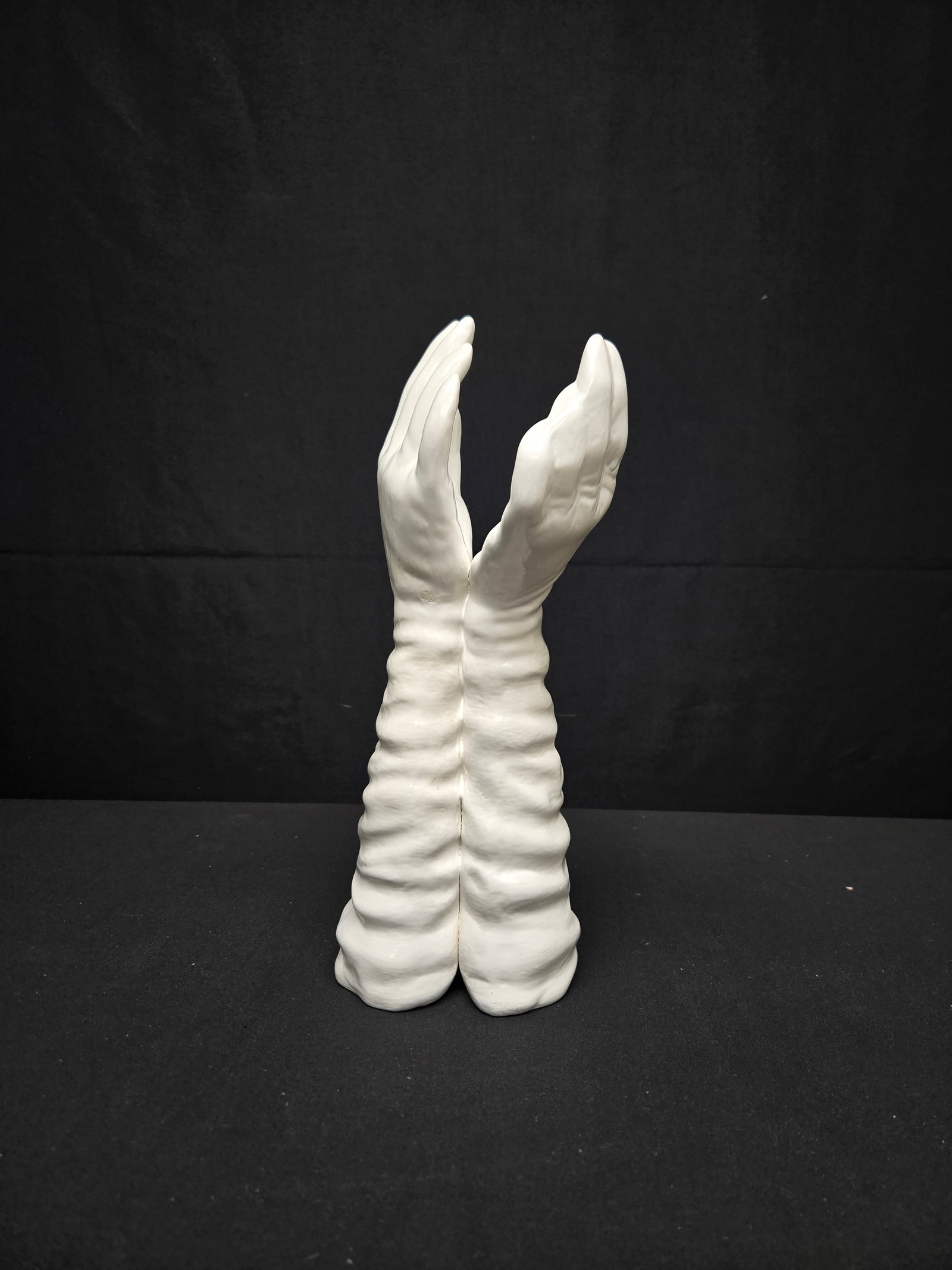 White Gloved Hands Resin Sculpture: White gloved hands connected at the wrist and extending upwards.