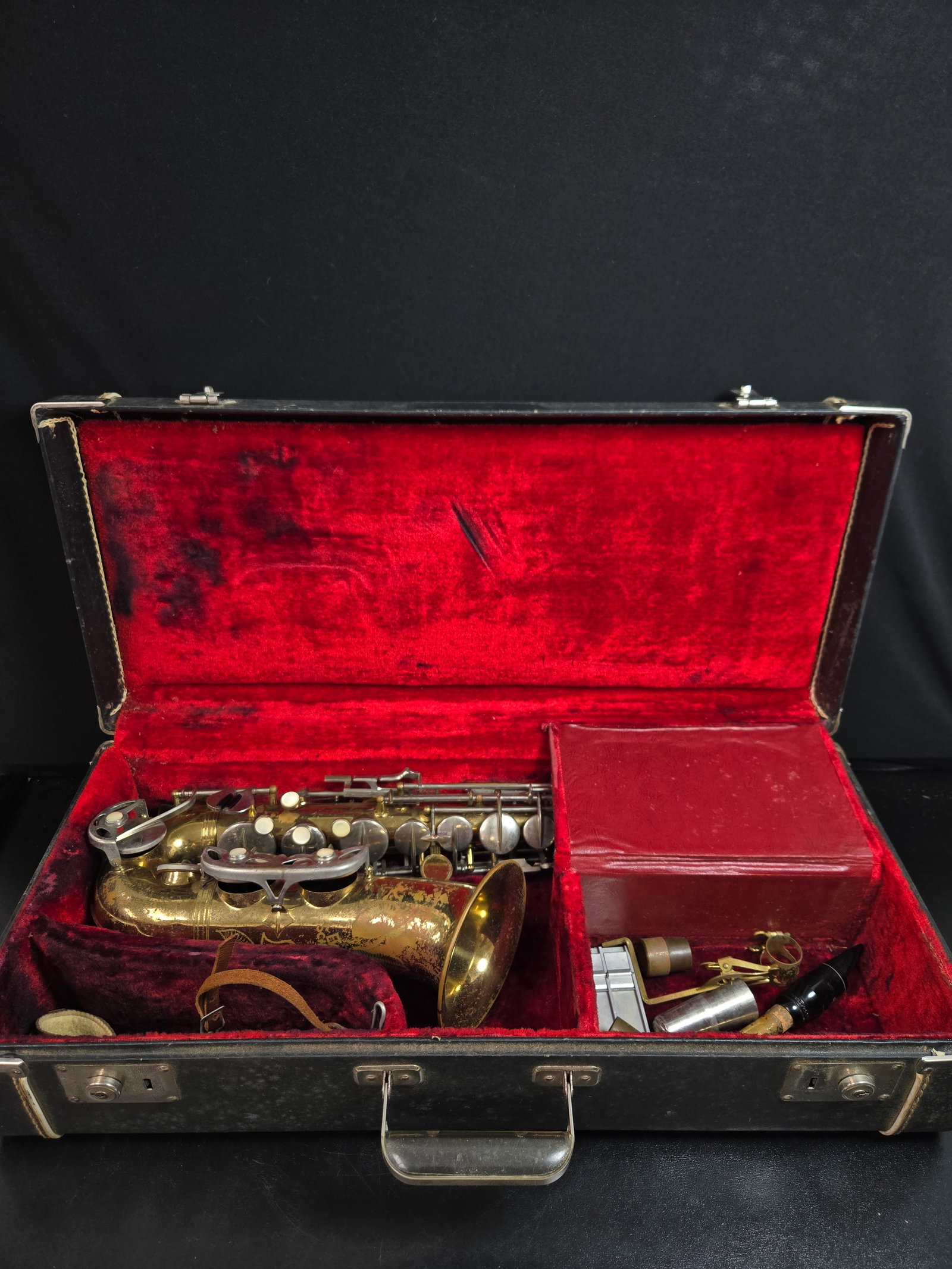 Evette & Schaeffer Saxaphone by Buffet: Small saxophone in leather, red velvet lined case. Evette & Schaeffer by Buffet, Paris, France. Complete with accessories.