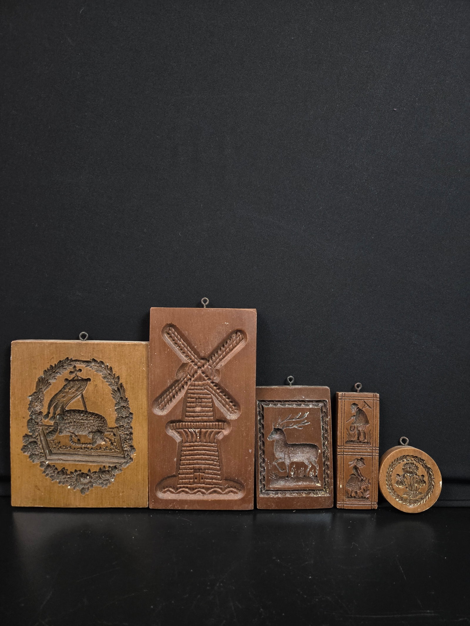 Springerle Cookie Molds Set of Five (5pc): Set of five springerle German cookie molds, each themed to a pastoral scene and depicting various aspects of nature and country life. A lamb, a windmill, a deer, two field workers, and a sprouting of
