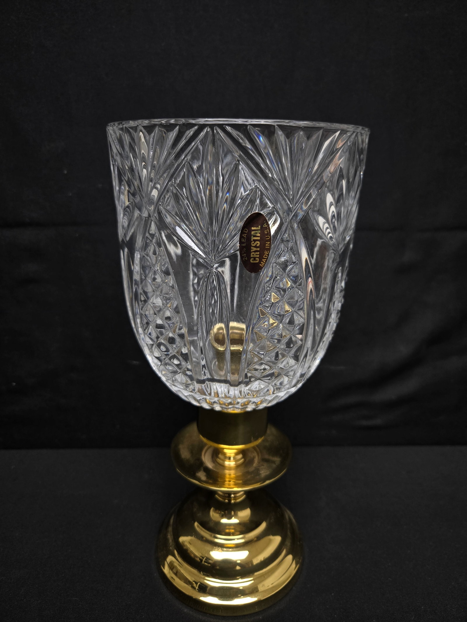 Cut Glass Hurricane Candle Light: Cut glass hurricane light with gilded brass base. Glass designed with a diamond and burst design.