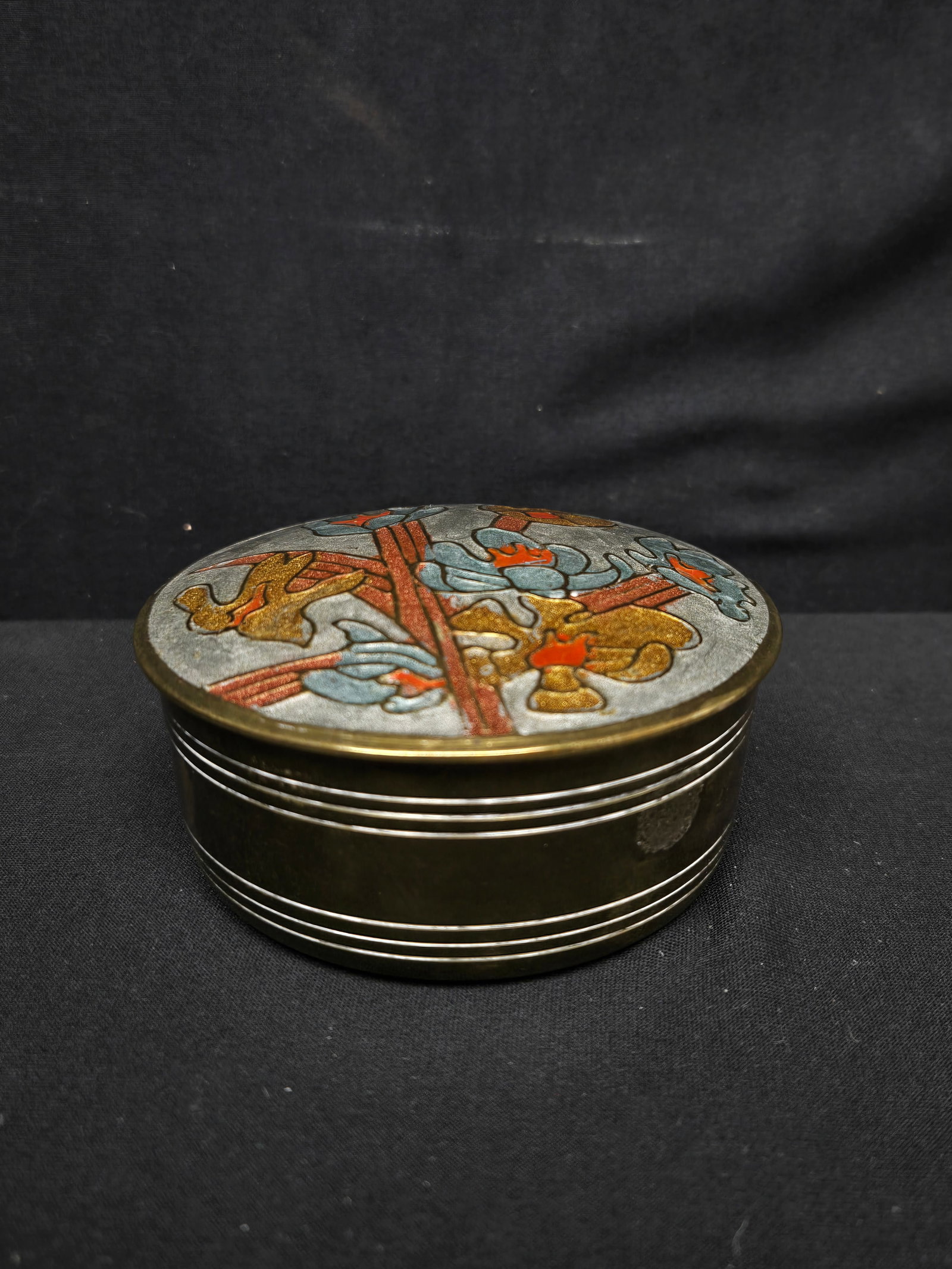 Trinket Box: Brass trinket box with blue lid embellished with blue and orange flowers.