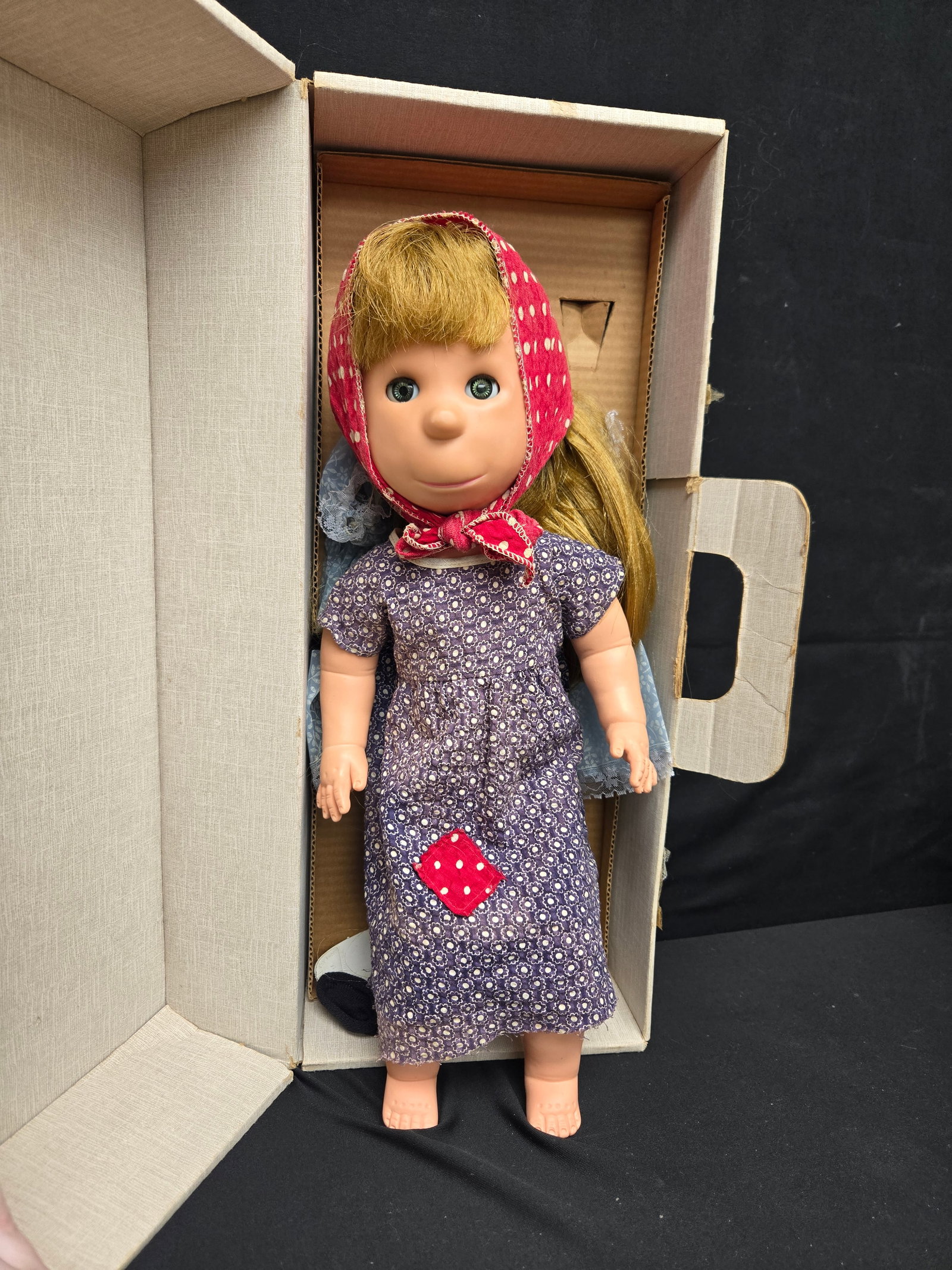 Poor Pitiful Pearl Doll In Original Box (2pc): Poor Pitiful Pearl doll manufactured in the 1950s by Brookglad Corp. in New York, NY. This doll comes complete with original cardboard box, two dresses, a felt four leaf clover, a pair of black shoes,