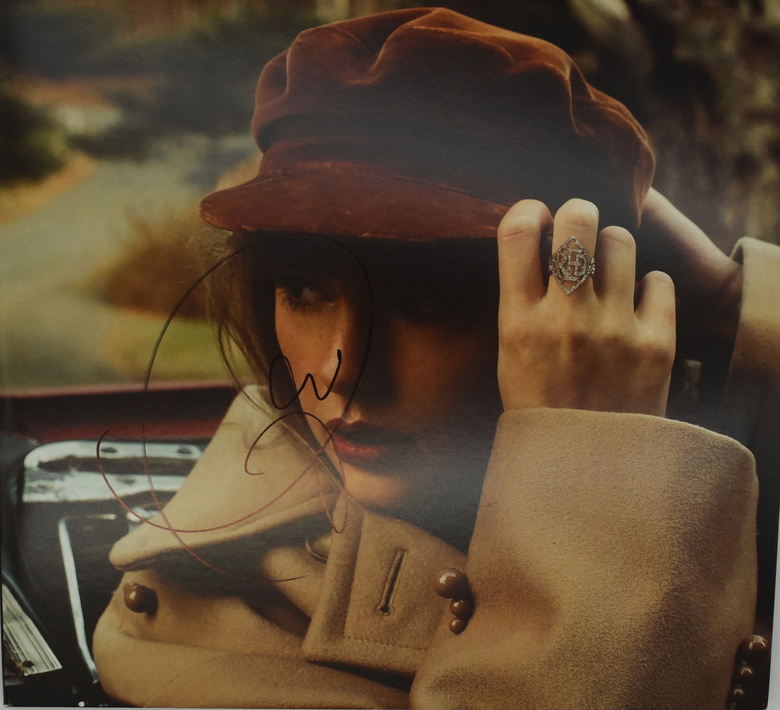 Taylor Swift autographed Red vinyl album cover (1 of 2)