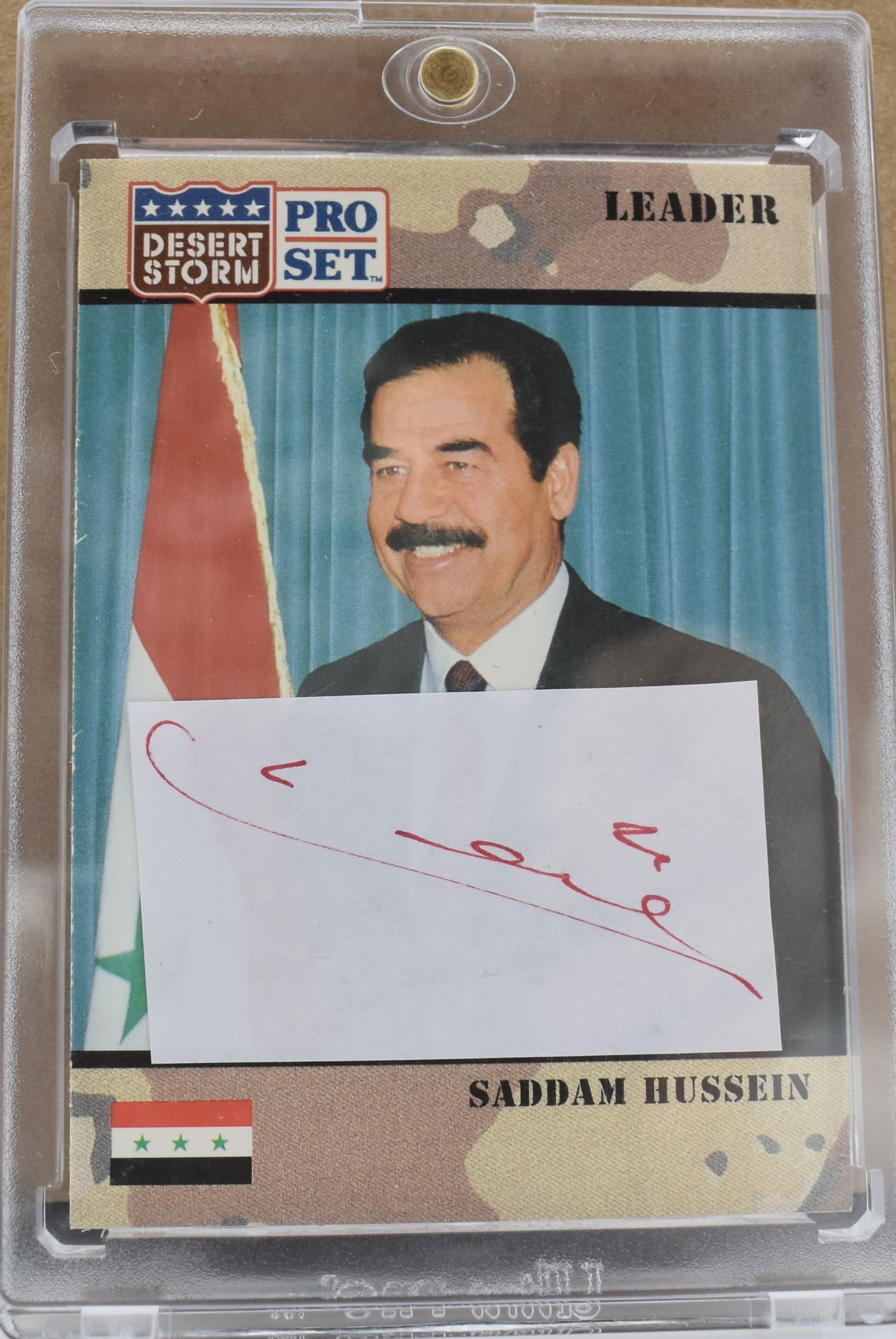 Saddam Hussein Pro Set card with cut autograph adhered (1 of 2)