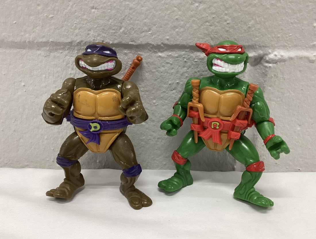 Pair of 1990 Teenage Mutant Ninja Turtles: With weapons