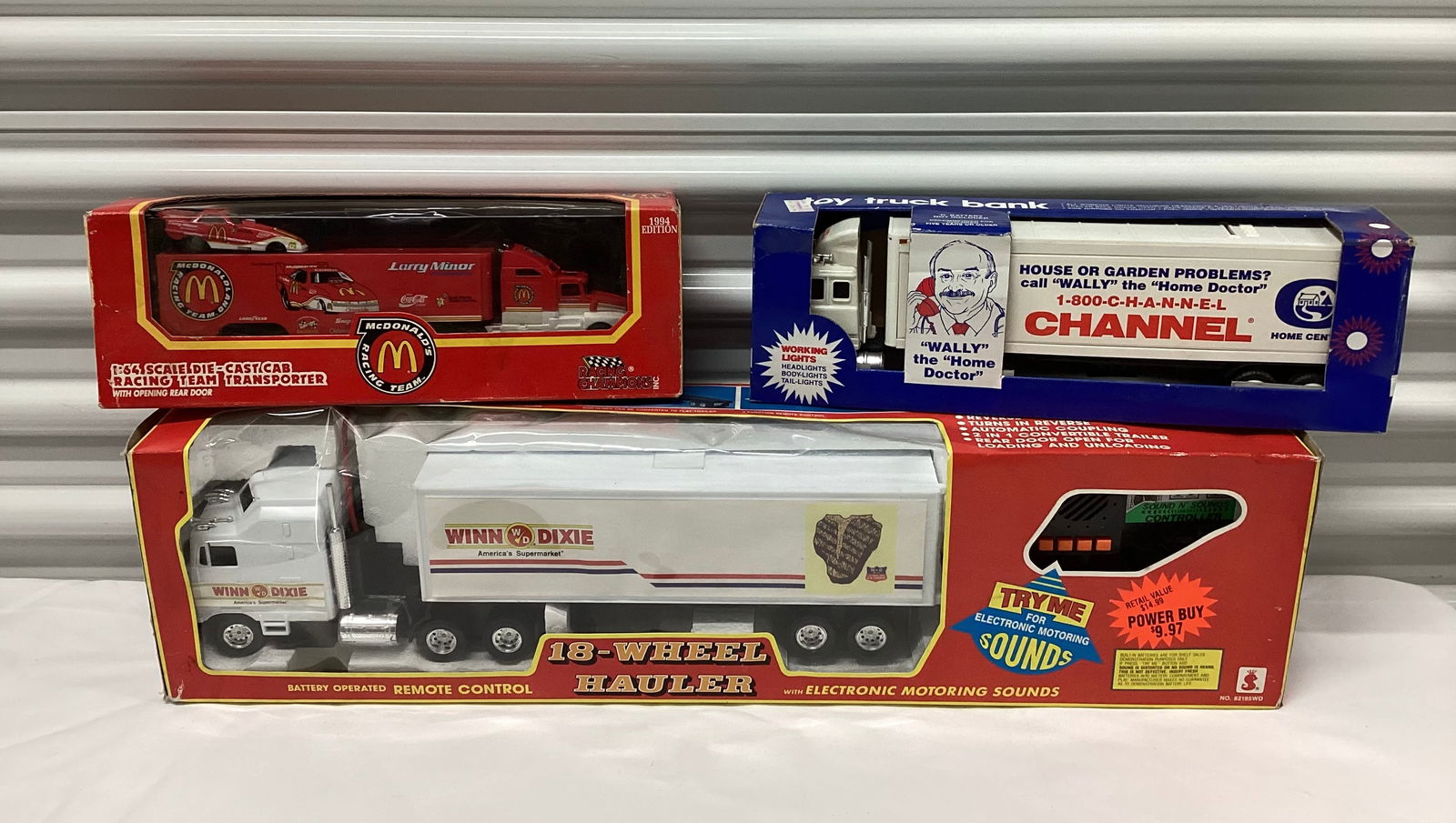 Three 1990s Toy Trucks incl Bank & McDonalds Racing: 1994 Racing Champions 1:64 Die Cast Cab Racing Team