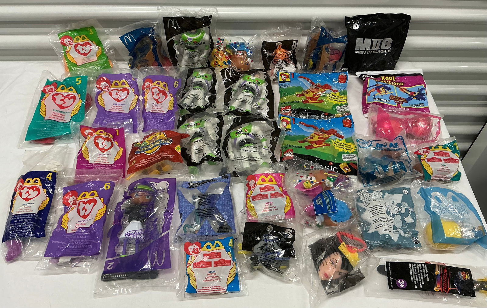 SEALED Happy Meal Toys Lego Simpsons Beanie Babies Land Before Time Toy Story: All Sealed except One (Inch Beanie Baby)