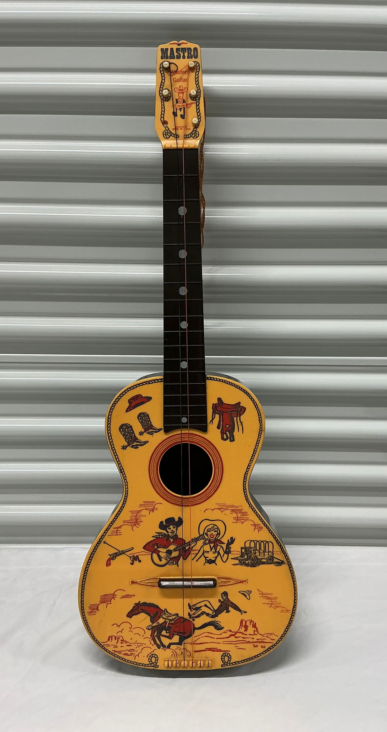 1950s Mastro Western Plastic Toy Guitar: 30.25 inches