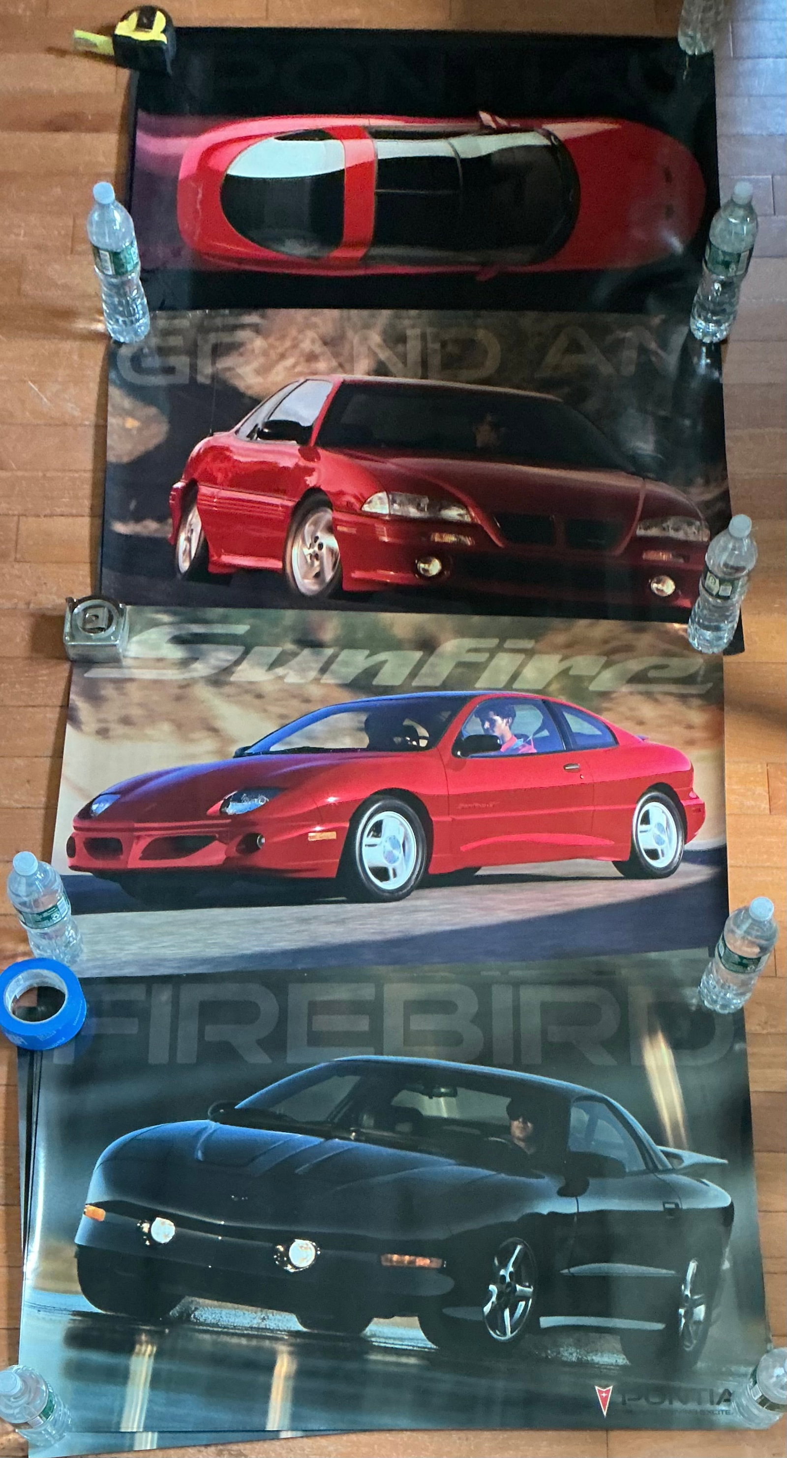 Collection of 11 Vintage Pontiac Car Posters: From Top To Bottom There Are 3,2, 2, 4 Posters Of Each Design 36x24