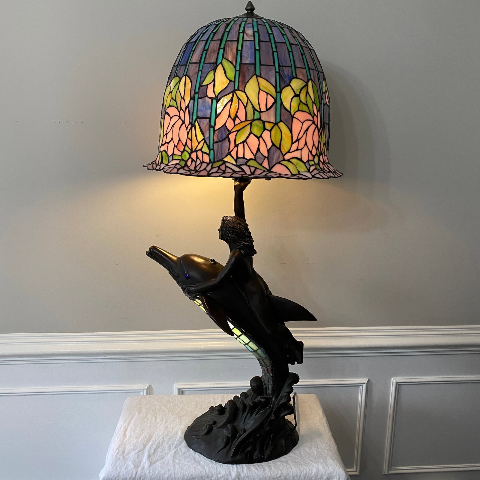 Tiffany Style Stained Glass Woman Riding A Dolphin Bronze Base Signed and Numbered 124 of 200: The size is 20” diameter, 14” wide, 20” tall glass and 44” floor to top.