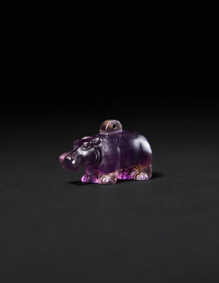 AN EGYPTIAN AMETHYST HIPPOPOTAMUS AMULET LATE PERIOD TO PTOLEMAIC PERIOD, 664-30 B.C. (1 of 2)