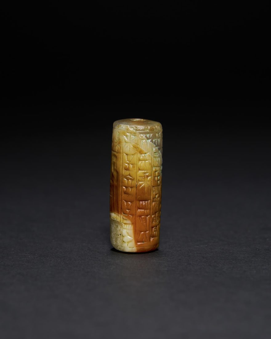 A KASSITE RED AND GREEN AGATE CYLINDER SEAL CIRCA 1400-1100 B.C. (1 of 7)