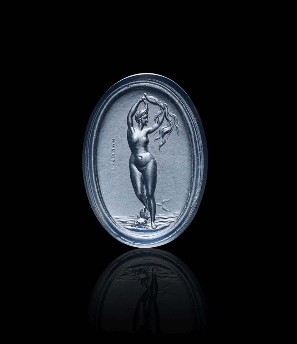 ATTRIBUTED TO VALERIO BELLI, VENUS ANADOYOMENE, VENUS RISING FROM THE SEA, INTAGLIO: ATTRIBUTED TO VALERIO BELLI, VENUS ANADOYOMENE, VENUS RISING FROM THE SEA, INTAGLIO A finely executed oval intaglio depicting Venus Anadyomene, the goddess emerging from the sea and wringing her l