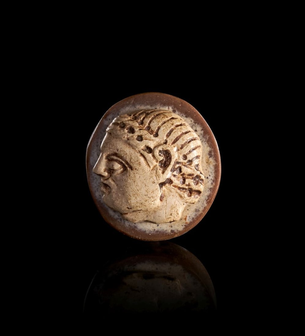 A ROMAN AGATE CAMEO WITH THE FACE OF AN ATHLETE, CIRCA 2ND-3RD CENTURY A.D.: Lot 216. A ROMAN AGATE CAMEO WITH THE FACE OF AN ATHLETE Circa 2nd–3rd Century A.D.