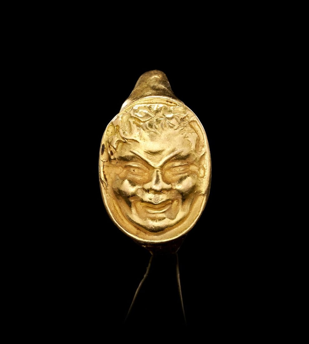 A ROMAN GOLD RING WITH A HIGH RELIEF OF A SATYR FACE, CIRCA 2ND CENTURY A.D. (1 of 4)