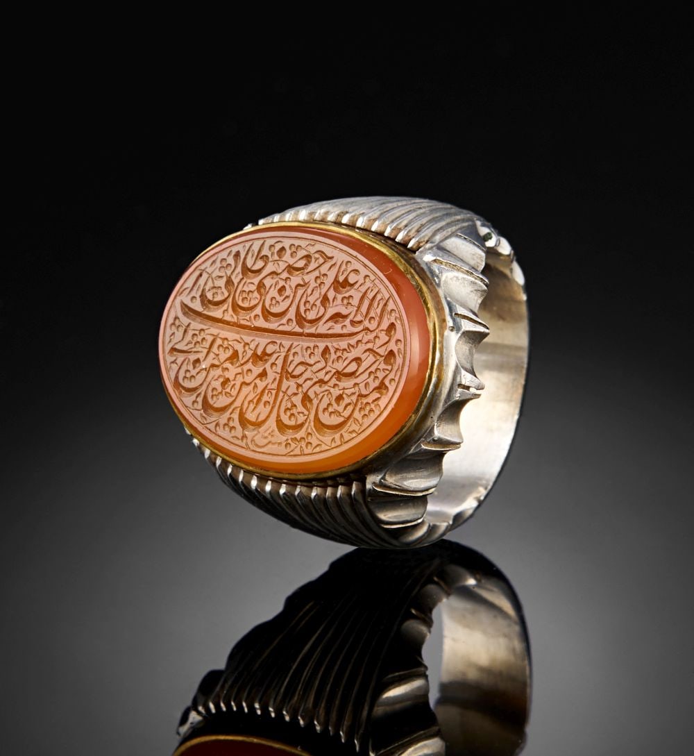 A CALLIGRAPHIC INSCRIBED AGATE RING, 19TH CENTURY, PERSIA (1 of 3)