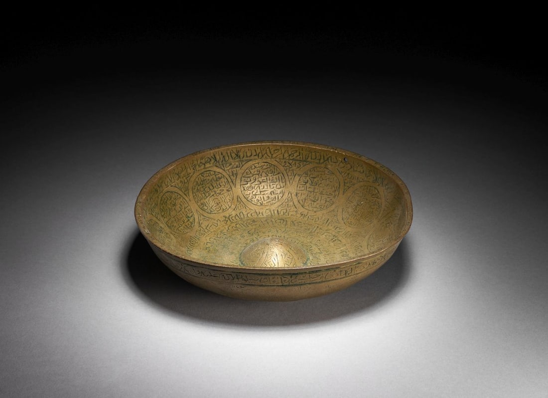 A BRASS MAGIC BOWL MAMLUK SYRIA, LATE 13TH CENTURY AND POSSIBLY EARLIER (1 of 5)