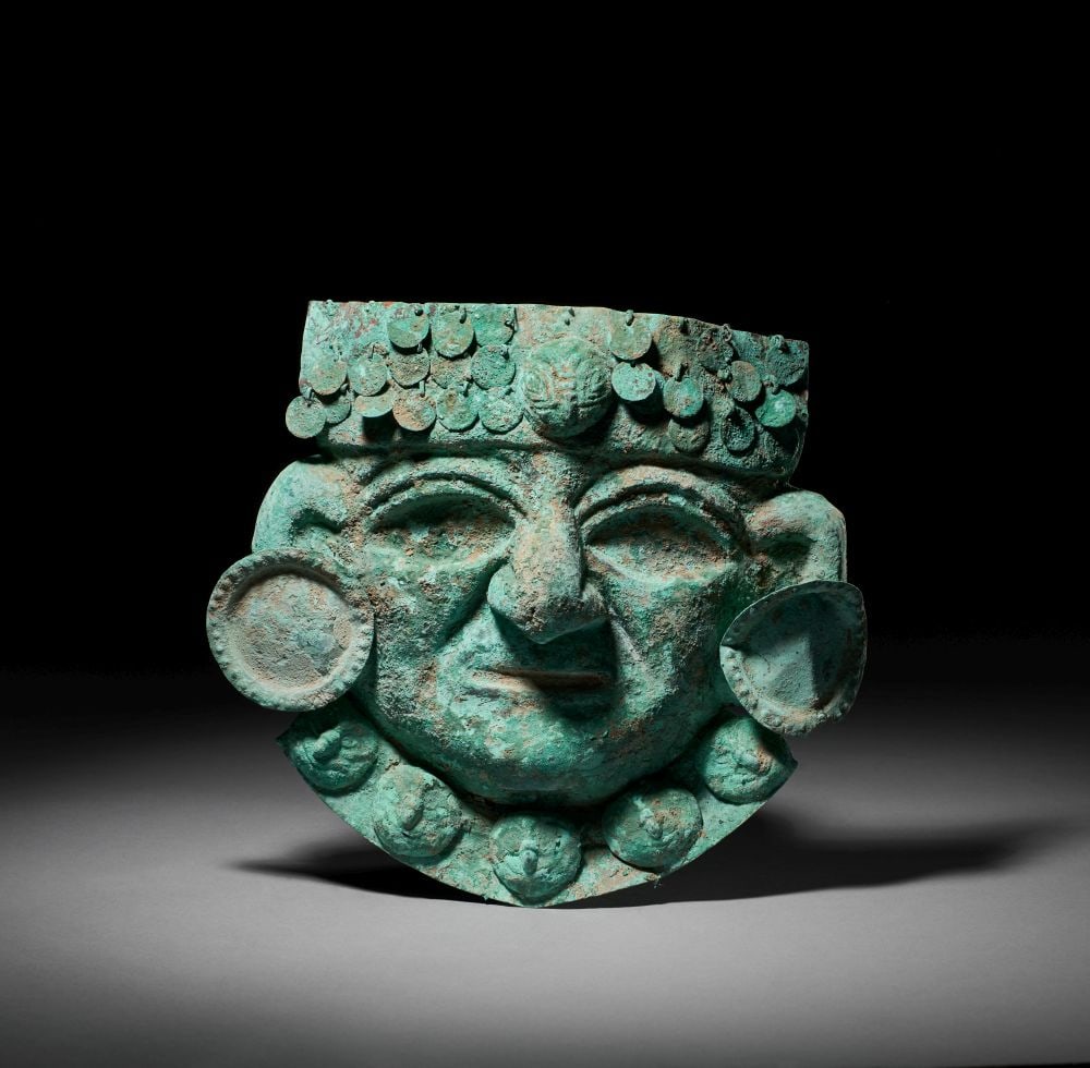 A PRE COLOMBIAN COPPER MOCHE BURIAL MASK, CIRCA 800-1200 A.D (1 of 4)